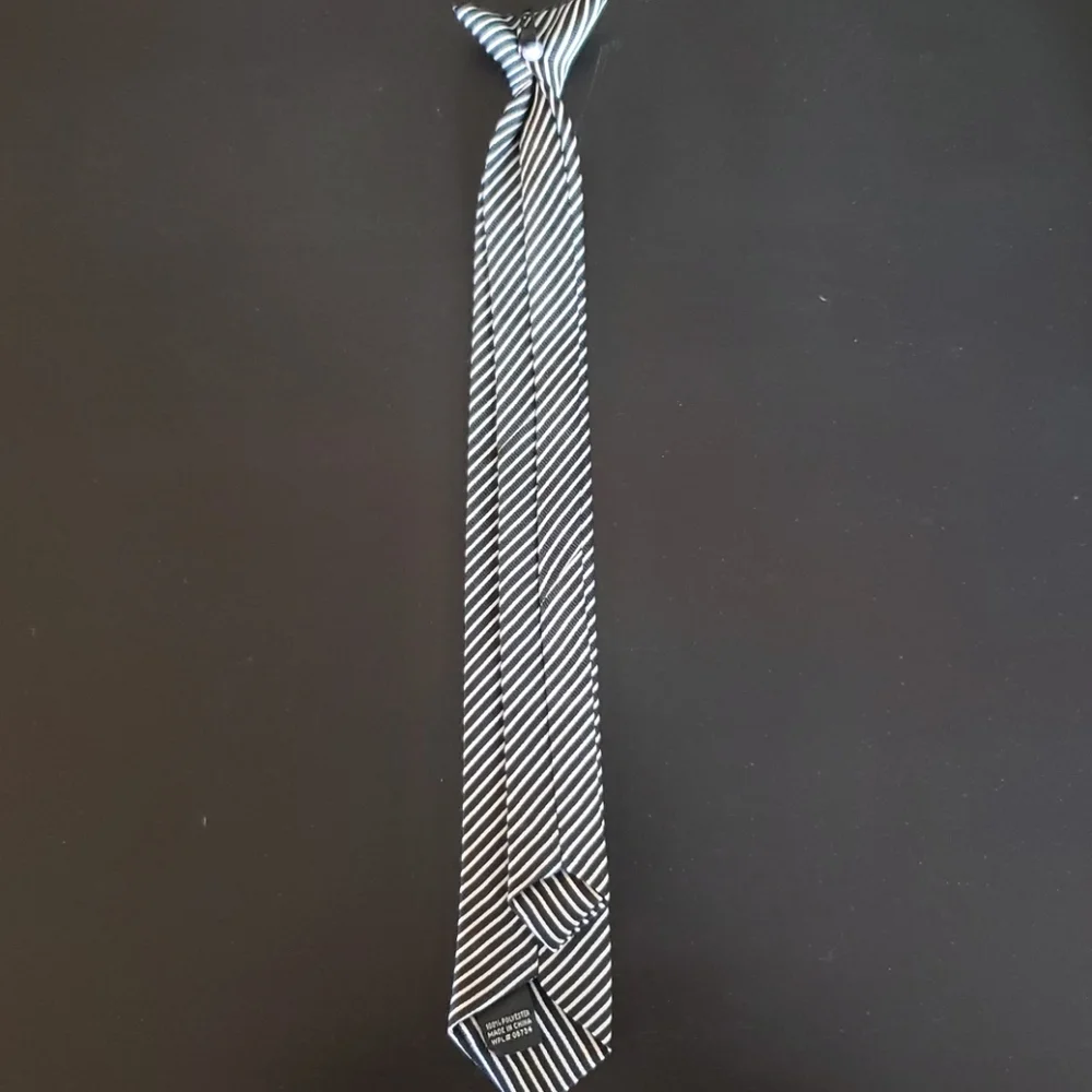 Boys black and white striped Polyeste clip on tie.
